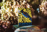 Box of Popinjay playing cards with a bird illustration on a floral background