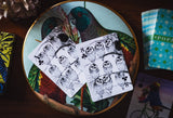 Playing cards with owl design on a decorative plate