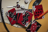 Playing cards with guitar design on a guitar body