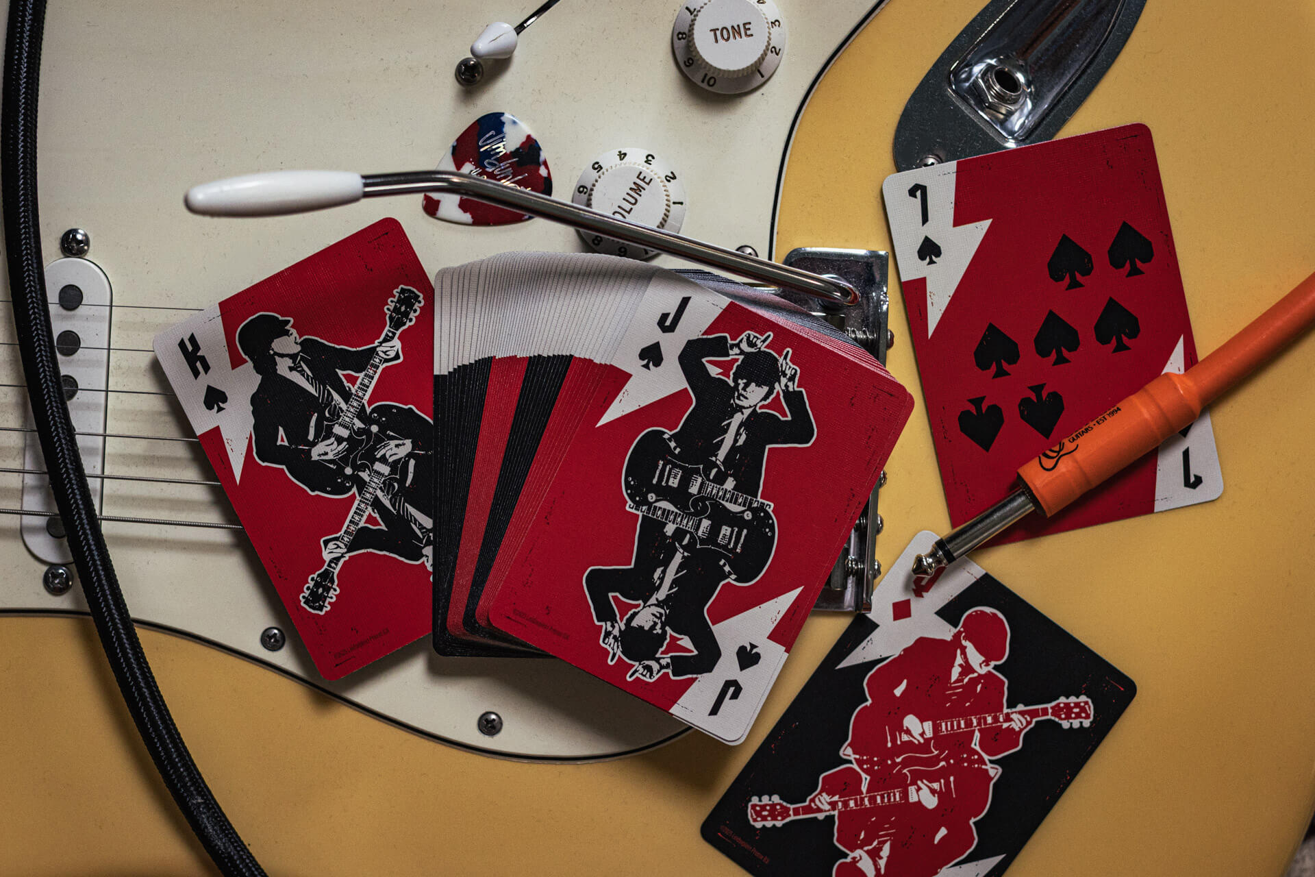 Playing cards with guitar design on a guitar body