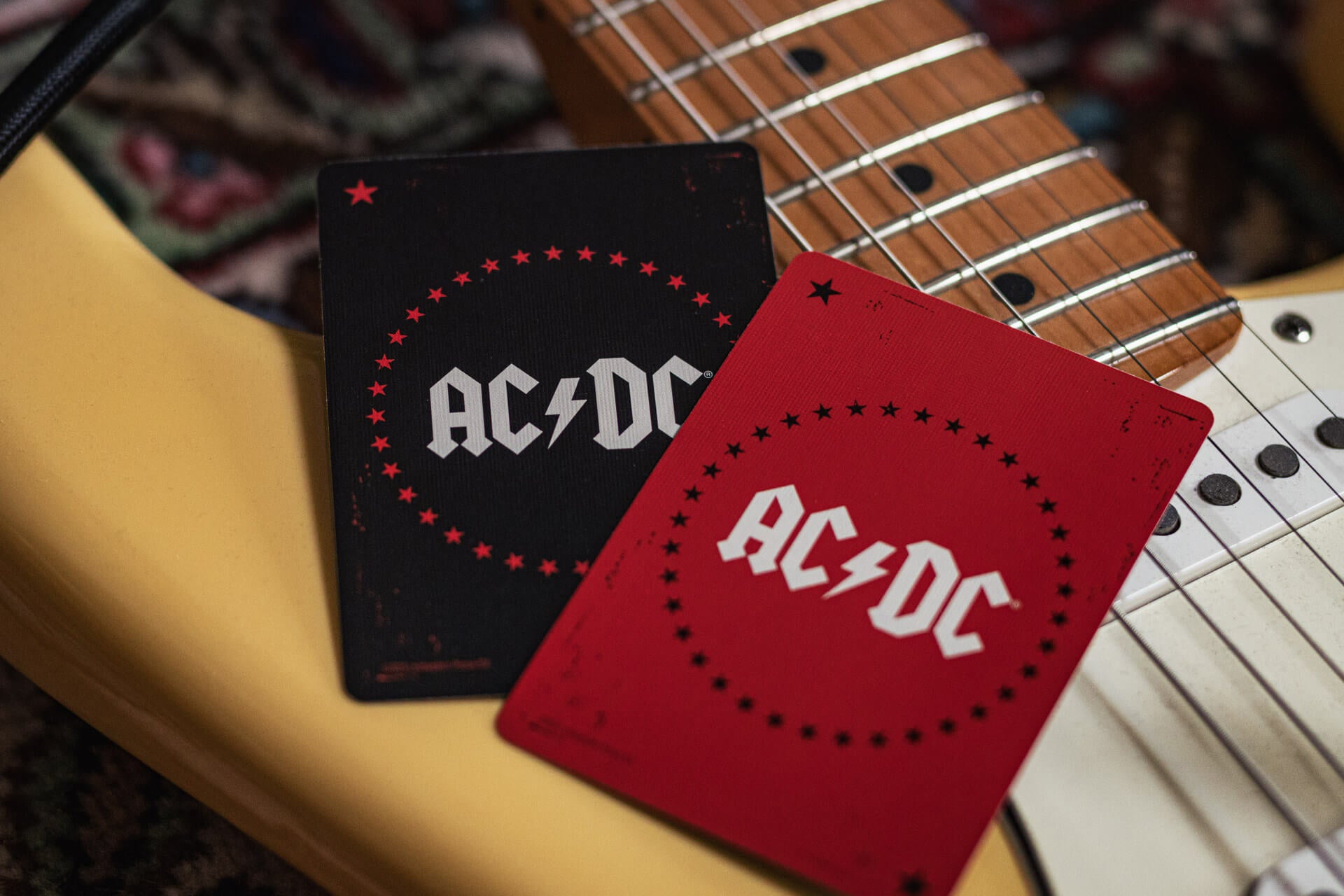 Two AC/DC jokers on a guitar