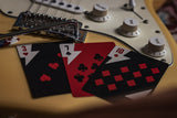 Playing cards on a guitar with close-up details