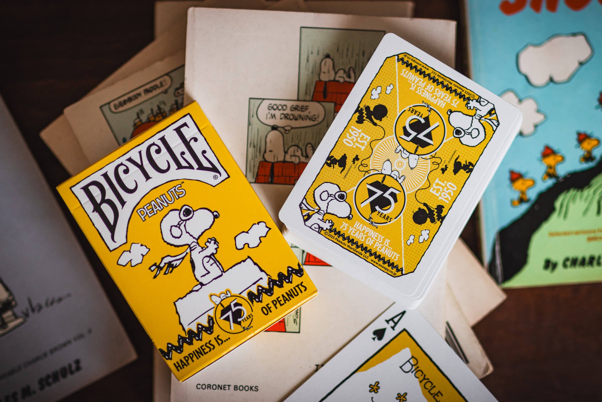 Peanuts-themed playing cards with visible branding and illustrations.