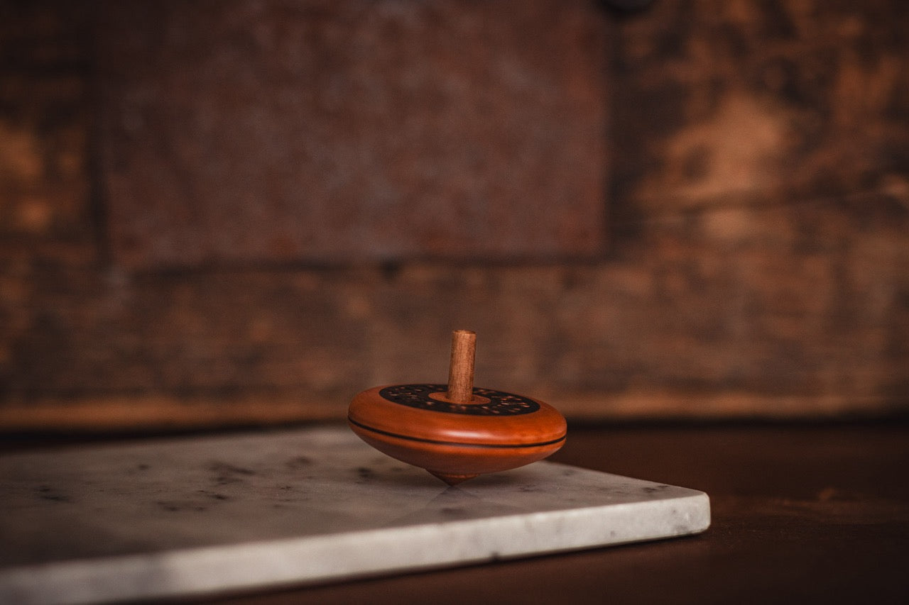 Leporello Spinning Top