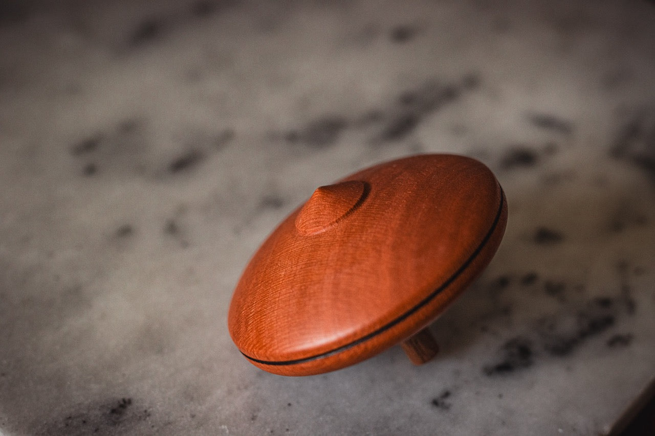 Leporello Spinning Top