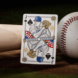 Playing card with a baseball player design, placed on a baseball and bat