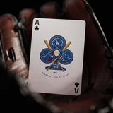 Playing card with Dodgers logo held in a glove